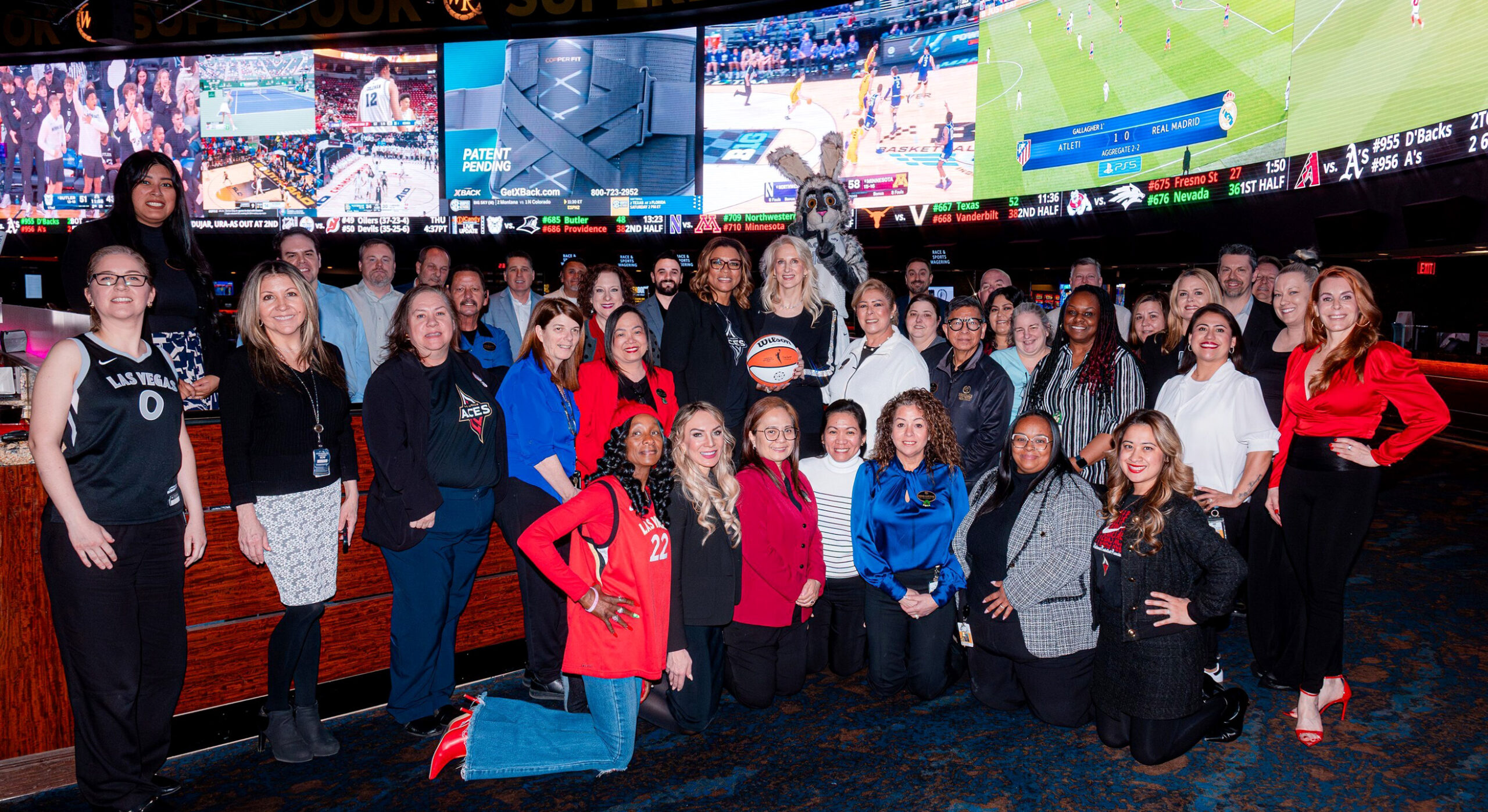 The Westgate Las Vegas Resort & Casino announced a new partnership between the property and the Las Vegas Aces on March 19. The partnership includes Westgate sponsorship of featured segments during local broadcasts of Aces games in the 2025 season. Additionally, Westgate will allow fans to play in-game slot machine activations at Aces home games and is the presenting partner of one of the Aces’ 11 home game giveaways in 2025. “We are proud to partner with the Las Vegas Aces, an incredible team that embodies excellence, determination, and the spirit of our great city,” said Cami Christensen (middle row center, to the right of the basketball), President and General Manager, Westgate Las Vegas. Pictured to Christensen’s left: Nikki Fargas, President of the two-time WNBA champion Las Vegas Aces.