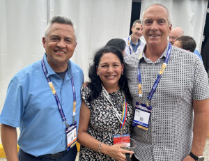 Leonard Hoops, President & CEO Visit Indy with his wife Dorene Hoops, and Michael Gamble, CEO Searchwide Global at the opening reception of the ASAE Annual meeting in Indianapolis.