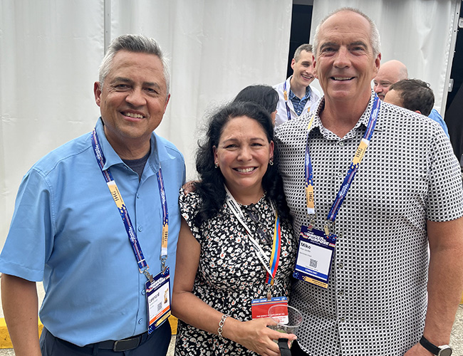 Leonard Hoops, President & CEO Visit Indy with his wife Dorene Hoops, and Michael Gamble, CEO Searchwide Global at the opening reception of the ASAE Annual meeting in Indianapolis.