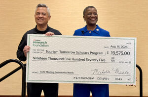 Michelle Mason, FASAE, CAE, AAiP, President & CEO, ASAE, presented a check to Leonard Hoops, President & CEO, Visit Indy, during the ASAE Annual Meeting & Exposition’s press conference on August 17 in Indianapolis. As part of ASAE’s Meeting Community Needs initiative, funds were raised through the 5K Fun Run/Walk and tours for Visit Indy’s Tourism Tomorrow Scholarship and Grant Program.