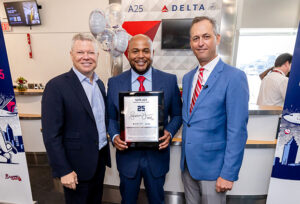 Former Atlanta Braves’ outfielder Andruw Jones, is part of the National Baseball Hall of Fame and Museum’s Class of 2026. Marking the occasion, Delta Air Lines and the Braves officially dedicated Gate A25 at Hartsfield-Jackson Atlanta International Airport in his honor. Shown here (left to right): Tim Mapes, SVP and Chief Communications Officer, Delta Air Lines; Jones; and Derek Schiller, Atlanta Braves President & CEO .