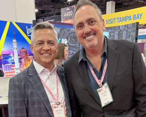 Leonard Hoops (left), President & CEO, Visit Indy, and Tony Lorenz, CMM, Founder, Head Sail, on the IMEX America show floor at Mandalay Bay, Las Vegas.