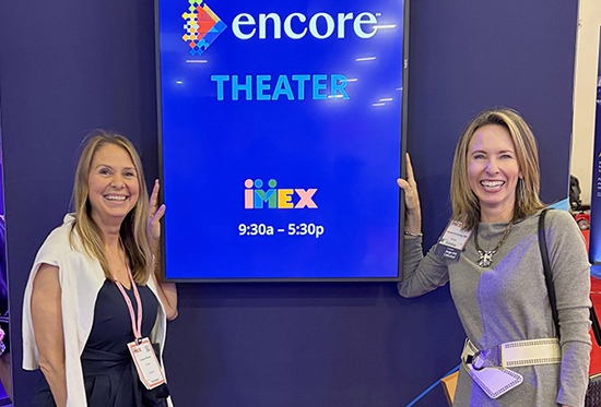 Encore’s Candace Mueller, Senior Director, Communications; and Amanda Armstrong, Senior Vice President, Industry Relations, at their organization’s booth at IMEX America.